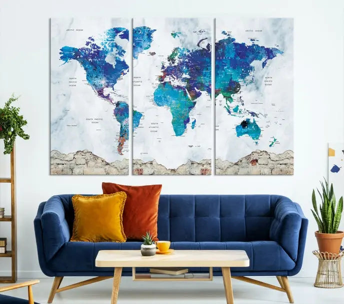 The living room features the striking Blue World Map Canvas Print—a five-panel abstract world map artwork on museum-quality canvas that is ready to hang.