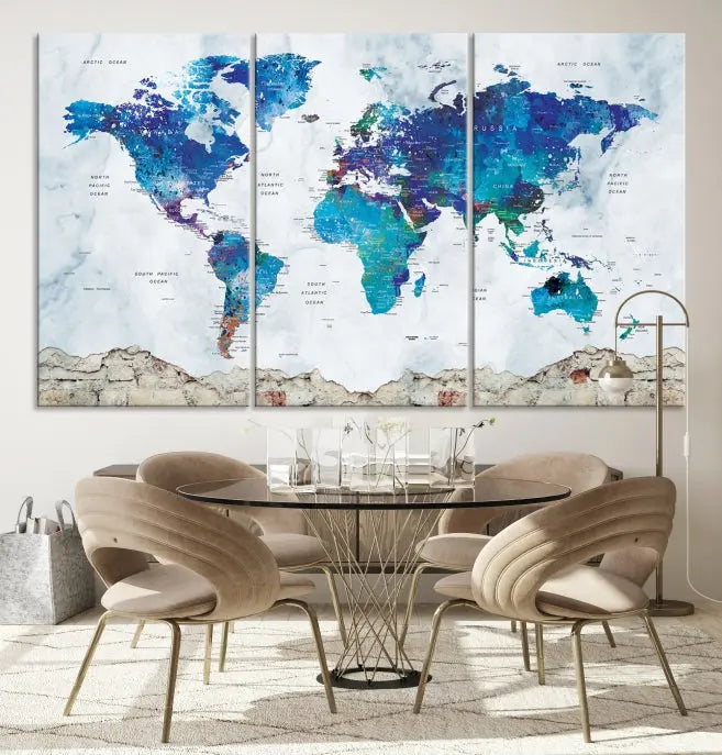 The living room features the striking Blue World Map Canvas Print—a five-panel abstract world map artwork on museum-quality canvas that is ready to hang.