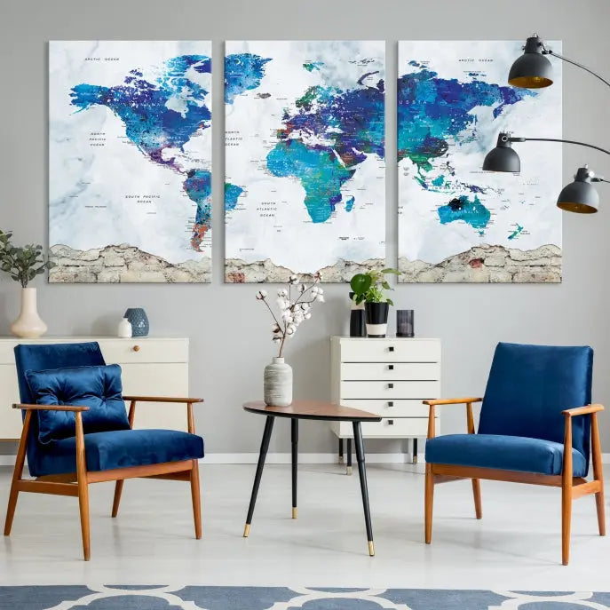 The living room features the striking Blue World Map Canvas Print—a five-panel abstract world map artwork on museum-quality canvas that is ready to hang.