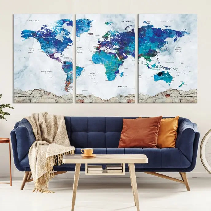 The living room features the striking Blue World Map Canvas Print—a five-panel abstract world map artwork on museum-quality canvas that is ready to hang.