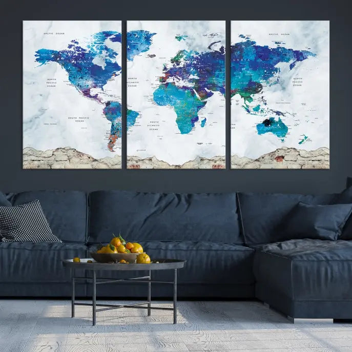 The living room features the striking Blue World Map Canvas Print—a five-panel abstract world map artwork on museum-quality canvas that is ready to hang.