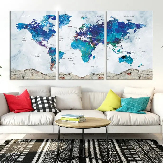 The living room features the striking Blue World Map Canvas Print—a five-panel abstract world map artwork on museum-quality canvas that is ready to hang.