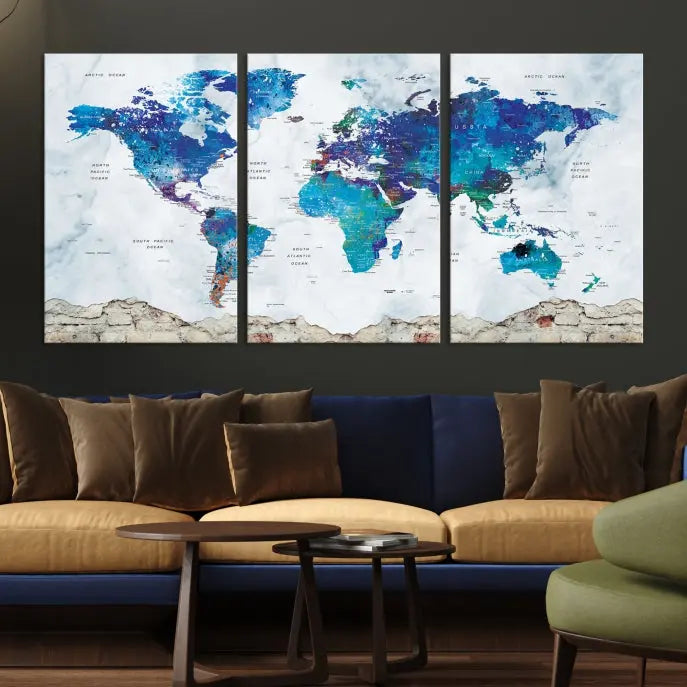 The living room features the striking Blue World Map Canvas Print—a five-panel abstract world map artwork on museum-quality canvas that is ready to hang.