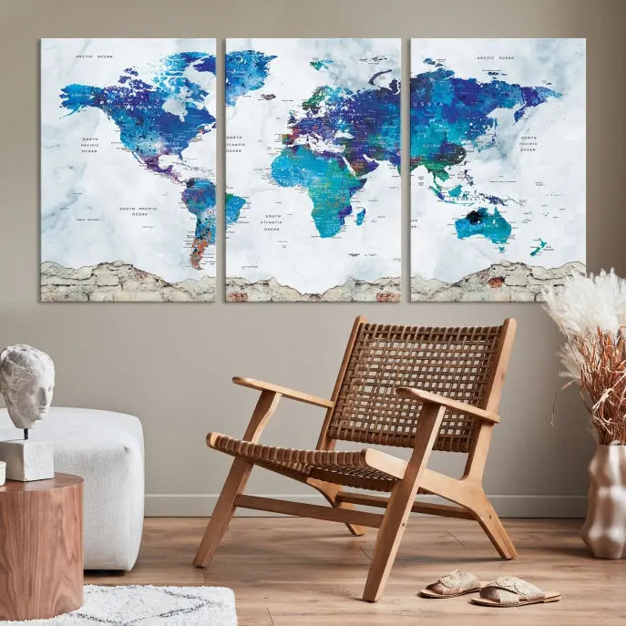 The living room features the striking Blue World Map Canvas Print—a five-panel abstract world map artwork on museum-quality canvas that is ready to hang.