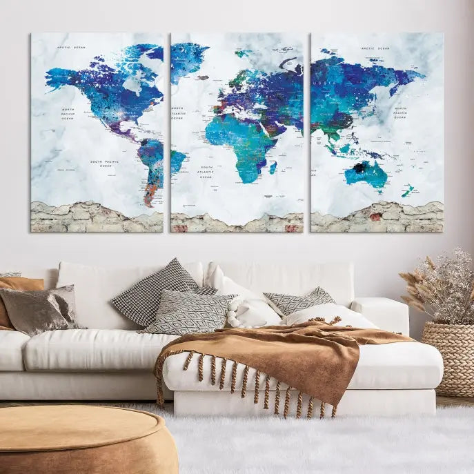 The living room features the striking Blue World Map Canvas Print—a five-panel abstract world map artwork on museum-quality canvas that is ready to hang.