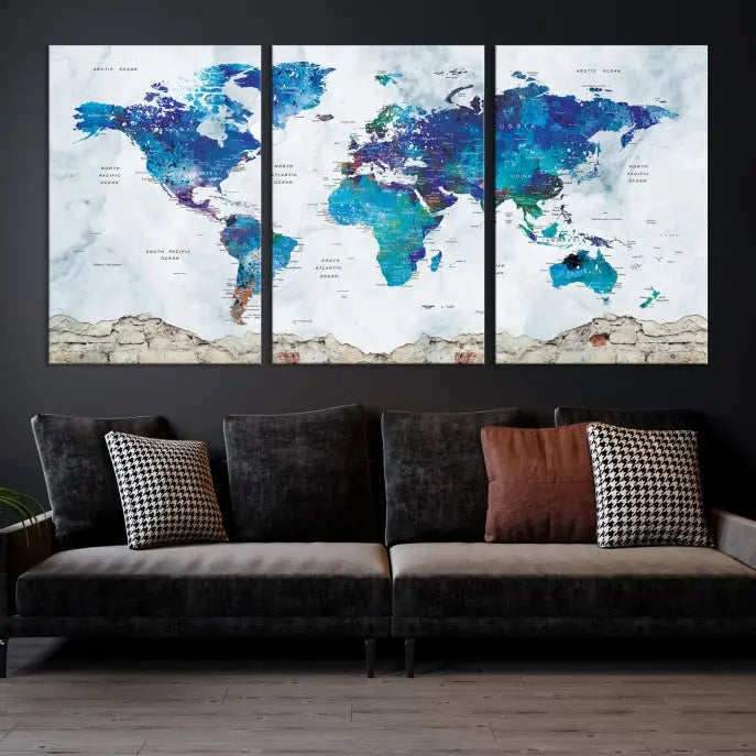 The living room features the striking Blue World Map Canvas Print—a five-panel abstract world map artwork on museum-quality canvas that is ready to hang.