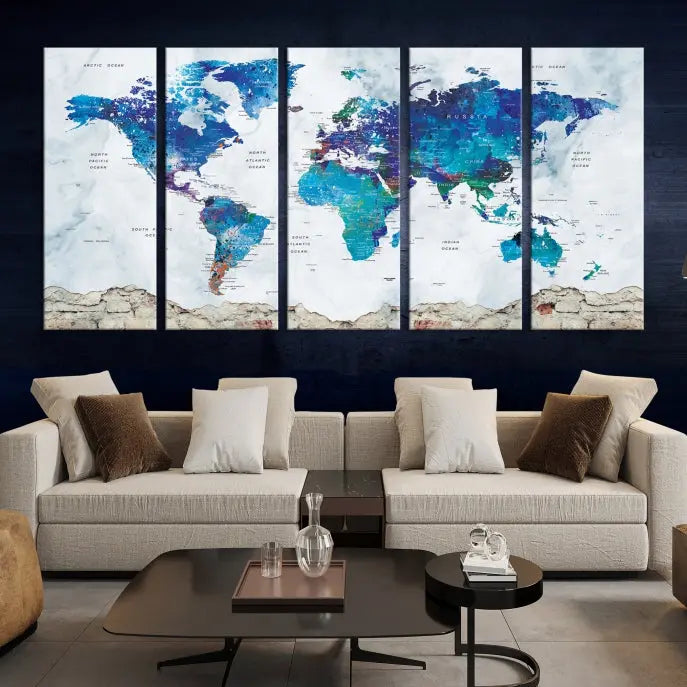 The living room features the striking Blue World Map Canvas Print—a five-panel abstract world map artwork on museum-quality canvas that is ready to hang.