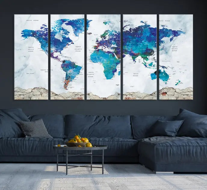 The living room features the striking Blue World Map Canvas Print—a five-panel abstract world map artwork on museum-quality canvas that is ready to hang.