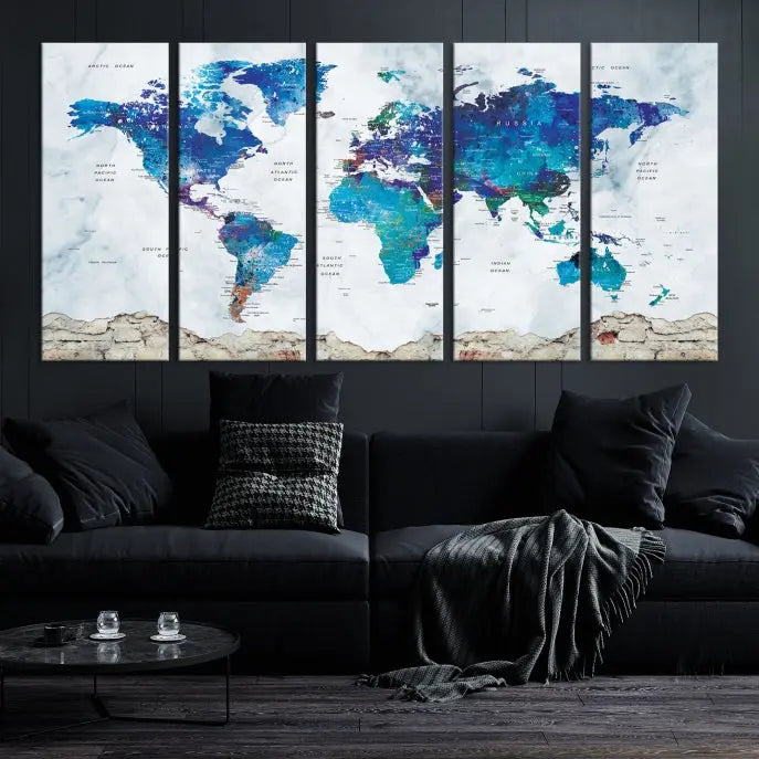 The living room features the striking Blue World Map Canvas Print—a five-panel abstract world map artwork on museum-quality canvas that is ready to hang.