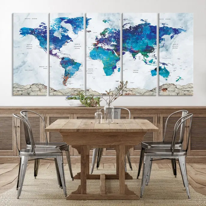 The living room features the striking Blue World Map Canvas Print—a five-panel abstract world map artwork on museum-quality canvas that is ready to hang.