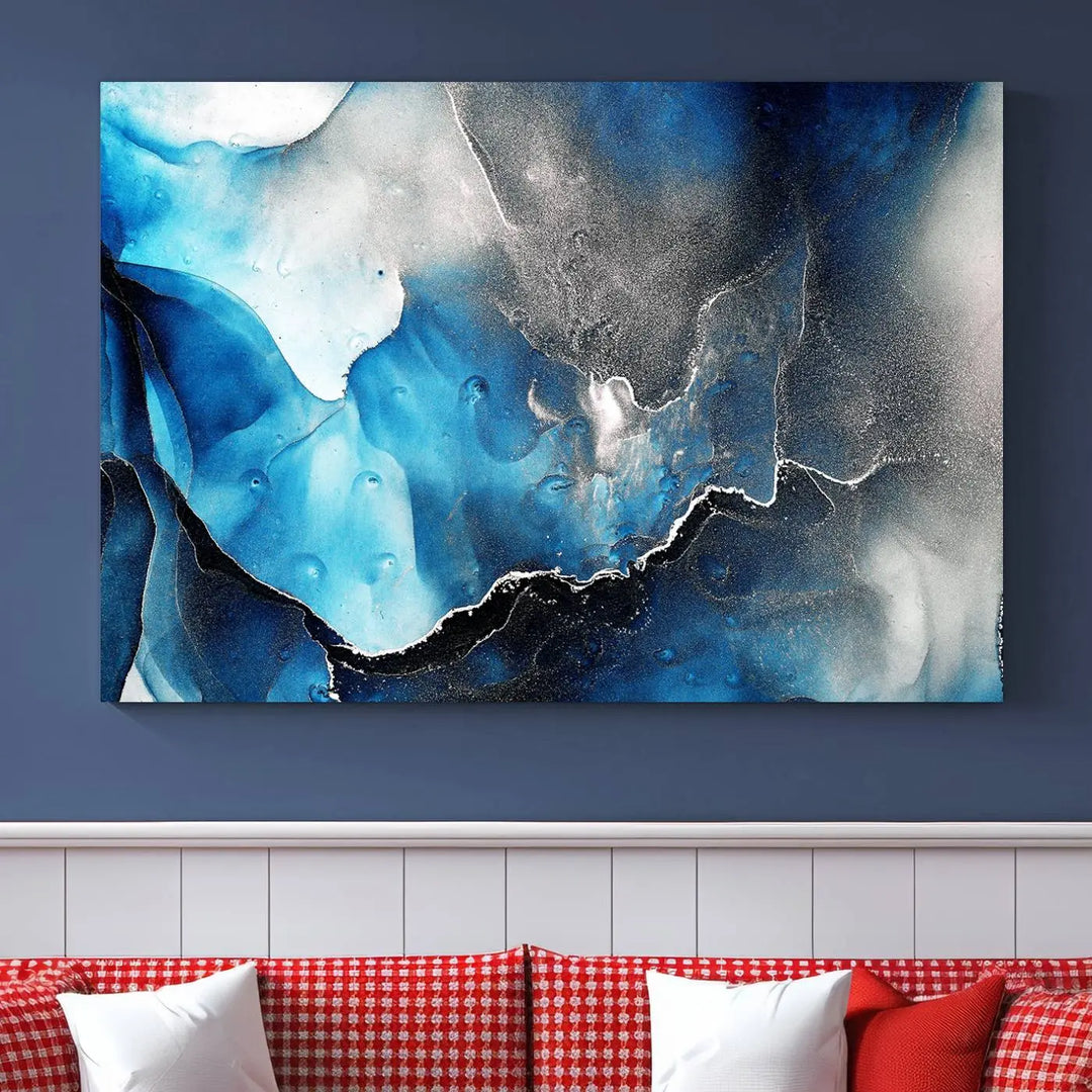 The Blue and Black Marble Fluid Effect Wall Art Abstract Canvas Prints feature three dynamic swirling patterns in blue, black, and white. Crafted on museum-quality canvases and enhanced with a UV-protective coating, these prints maintain their vibrant allure over time.