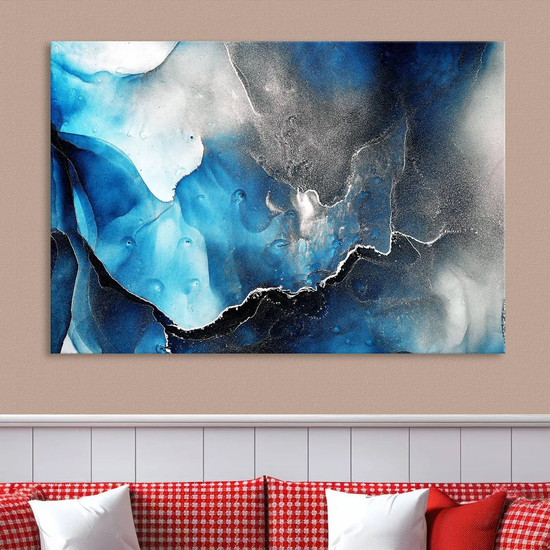 The Blue and Black Marble Fluid Effect Wall Art Abstract Canvas Prints feature three dynamic swirling patterns in blue, black, and white. Crafted on museum-quality canvases and enhanced with a UV-protective coating, these prints maintain their vibrant allure over time.