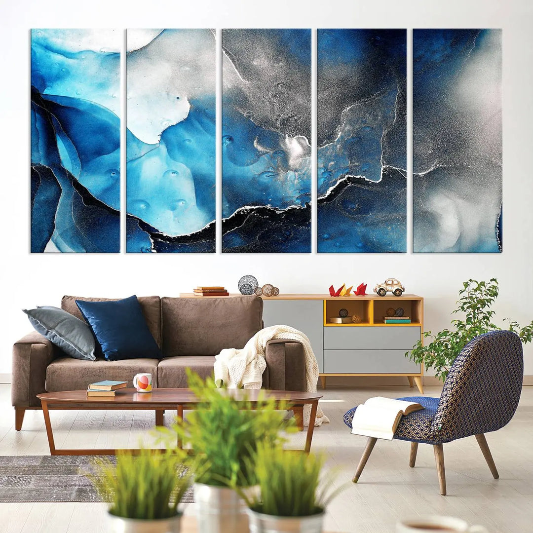 The Blue and Black Marble Fluid Effect Wall Art Abstract Canvas Prints feature three dynamic swirling patterns in blue, black, and white. Crafted on museum-quality canvases and enhanced with a UV-protective coating, these prints maintain their vibrant allure over time.