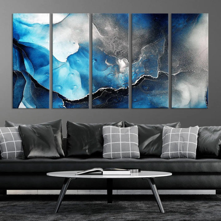 The Blue and Black Marble Fluid Effect Wall Art Abstract Canvas Prints feature three dynamic swirling patterns in blue, black, and white. Crafted on museum-quality canvases and enhanced with a UV-protective coating, these prints maintain their vibrant allure over time.