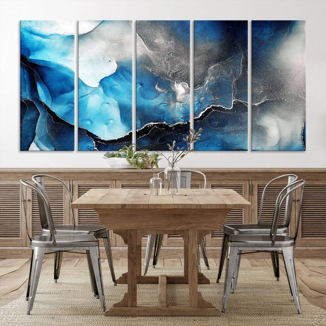 The Blue and Black Marble Fluid Effect Wall Art Abstract Canvas Prints feature three dynamic swirling patterns in blue, black, and white. Crafted on museum-quality canvases and enhanced with a UV-protective coating, these prints maintain their vibrant allure over time.