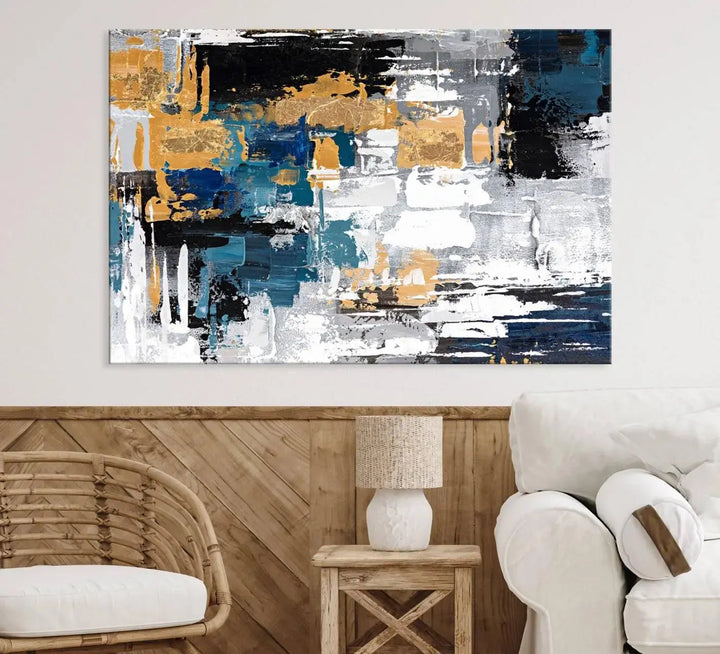 The Blue and Gold Abstract Canvas Wall Art – a triptych modern painting that's framed and ready to hang – features captivating brush strokes in blue, gold, black, and white to enhance the living room decor.