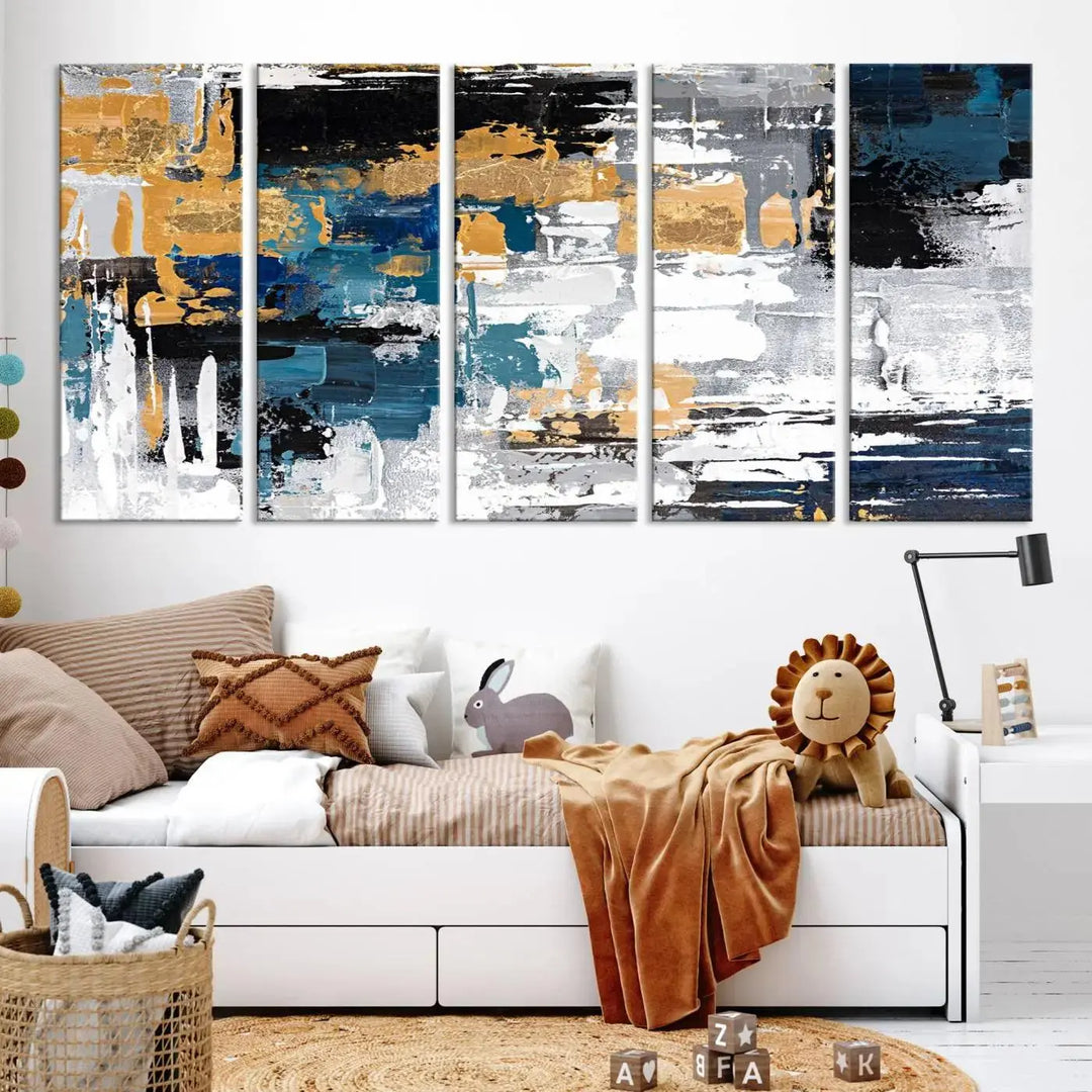 The Blue and Gold Abstract Canvas Wall Art – a triptych modern painting that's framed and ready to hang – features captivating brush strokes in blue, gold, black, and white to enhance the living room decor.