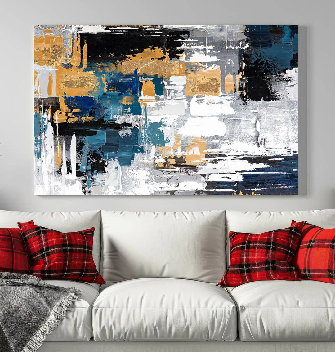 A sophisticated display of the Blue and Gold Abstract Canvas Wall Art – Triptych Modern Painting, featuring a captivating blend of blue, gold, black, and white tones, is elegantly framed and ready to hang.