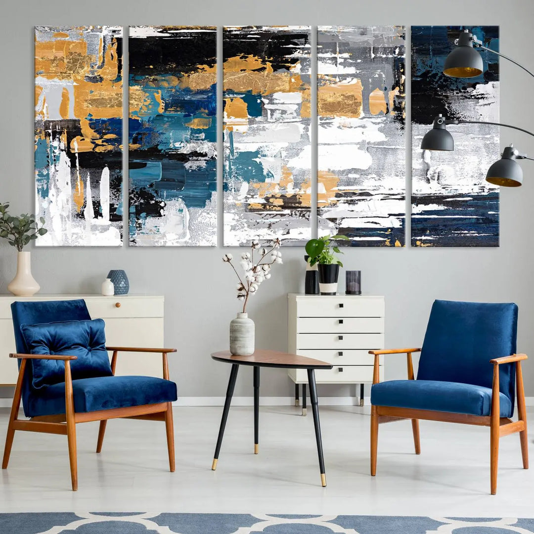 A sophisticated display of the Blue and Gold Abstract Canvas Wall Art – Triptych Modern Painting, featuring a captivating blend of blue, gold, black, and white tones, is elegantly framed and ready to hang.