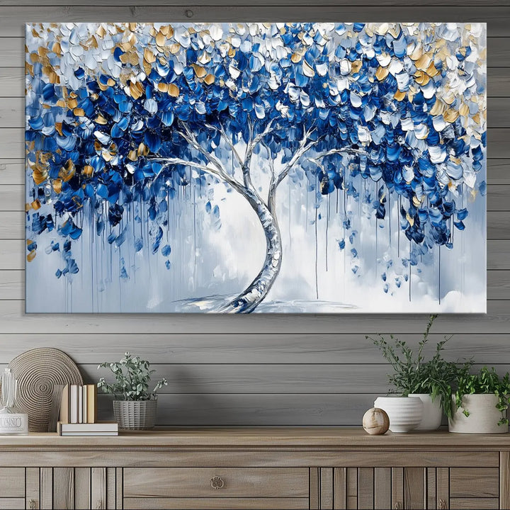 A framed canvas print of the Blue and Gold Abstract Tree Wall Art, depicting a modern Tree of Life painting, graces the dark wall, infusing the space with contemporary design and elegance.