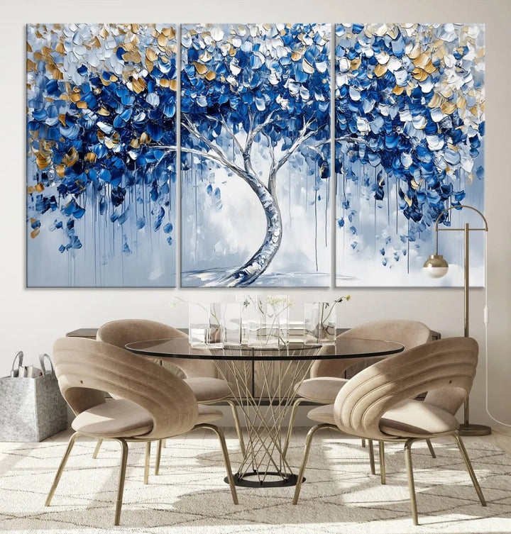 A framed canvas print of the Blue and Gold Abstract Tree Wall Art, depicting a modern Tree of Life painting, graces the dark wall, infusing the space with contemporary design and elegance.