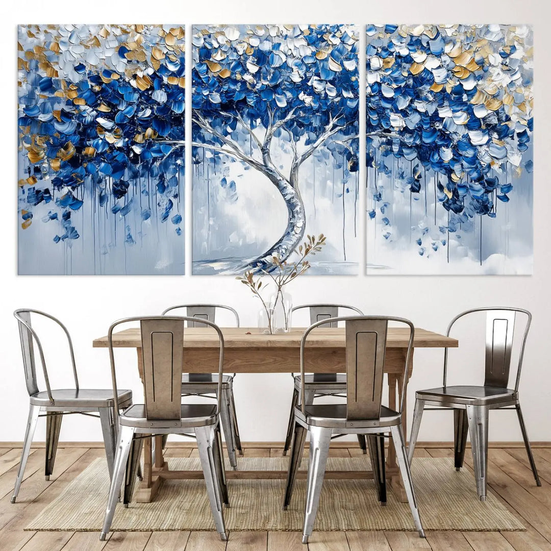 A framed canvas print of the Blue and Gold Abstract Tree Wall Art, depicting a modern Tree of Life painting, graces the dark wall, infusing the space with contemporary design and elegance.