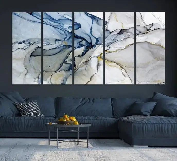 The "Blue and Gray Marble Fluid Effect Wall Art Abstract Canvas Wall Art Print" graces the dark wall, ready to hang. This triptych abstract art boasts a UV-protective coating for vibrant longevity in your space.