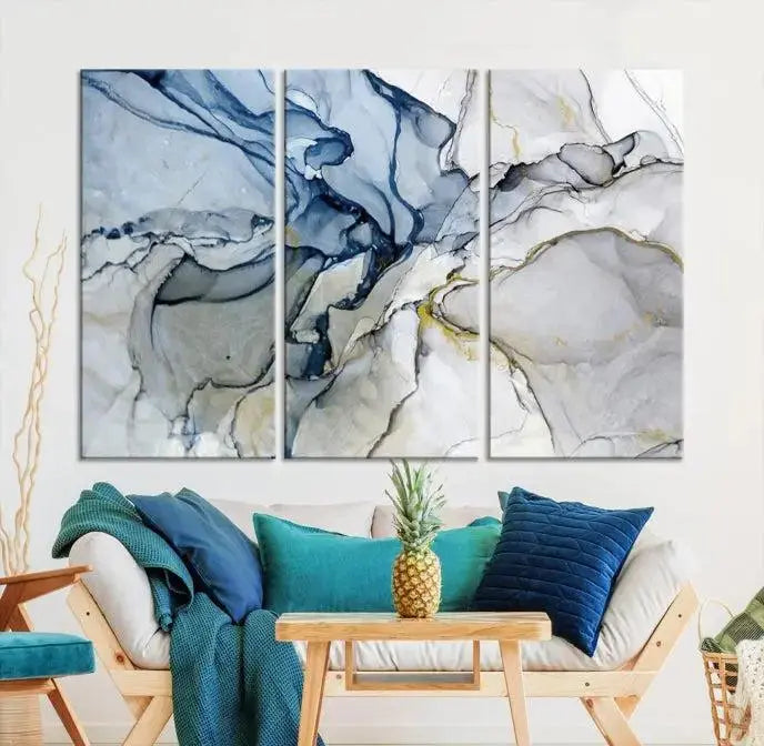 The "Blue and Gray Marble Fluid Effect Wall Art Abstract Canvas Wall Art Print" graces the dark wall, ready to hang. This triptych abstract art boasts a UV-protective coating for vibrant longevity in your space.