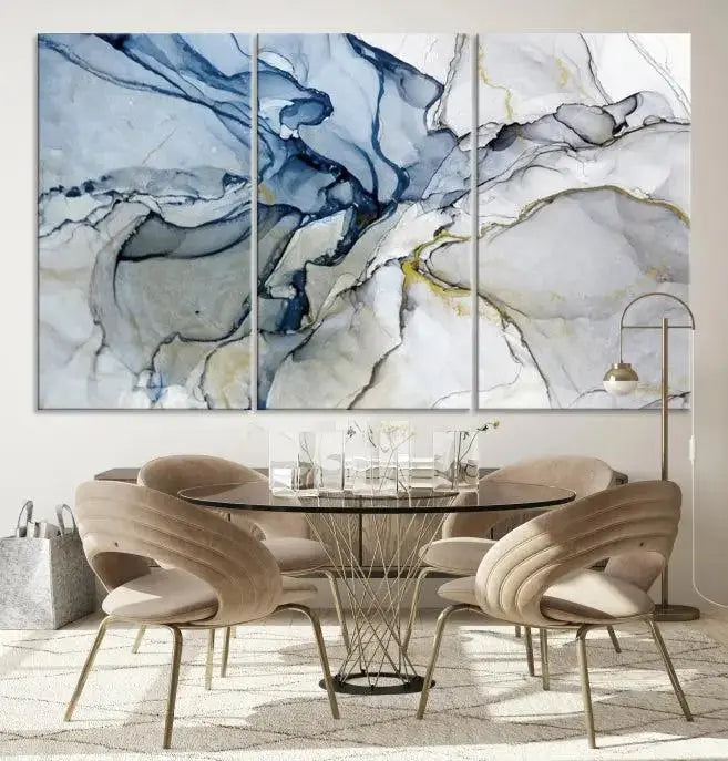 The "Blue and Gray Marble Fluid Effect Wall Art Abstract Canvas Wall Art Print" graces the dark wall, ready to hang. This triptych abstract art boasts a UV-protective coating for vibrant longevity in your space.