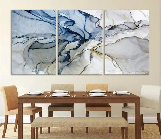 The "Blue and Gray Marble Fluid Effect Wall Art Abstract Canvas Wall Art Print" graces the dark wall, ready to hang. This triptych abstract art boasts a UV-protective coating for vibrant longevity in your space.