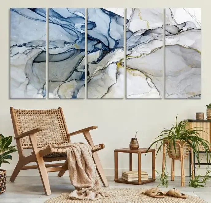 The "Blue and Gray Marble Fluid Effect Wall Art Abstract Canvas Wall Art Print" graces the dark wall, ready to hang. This triptych abstract art boasts a UV-protective coating for vibrant longevity in your space.