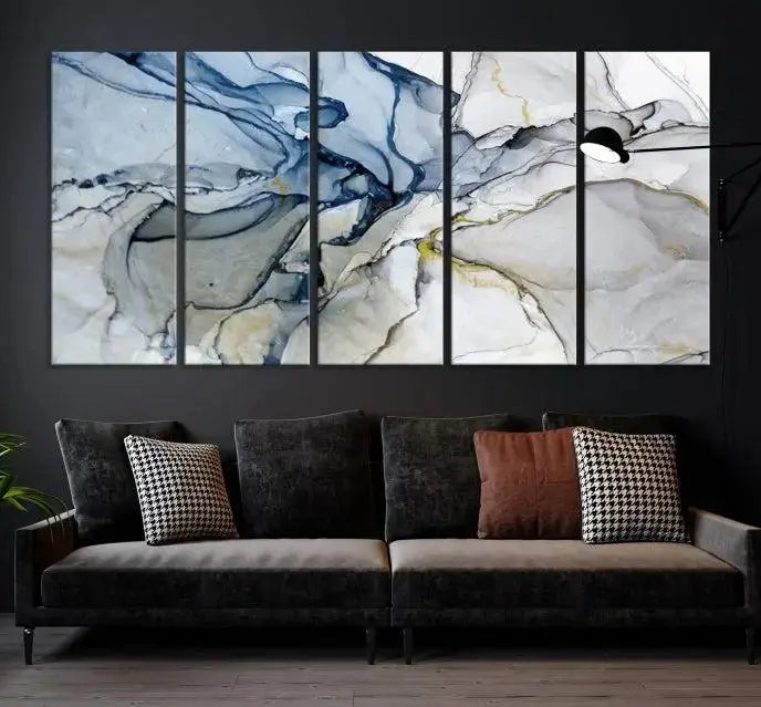 The "Blue and Gray Marble Fluid Effect Wall Art Abstract Canvas Wall Art Print" graces the dark wall, ready to hang. This triptych abstract art boasts a UV-protective coating for vibrant longevity in your space.