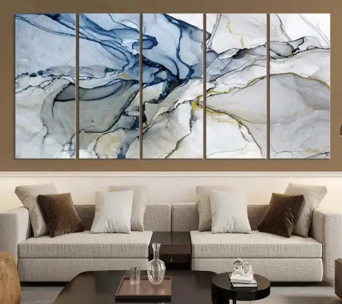 The "Blue and Gray Marble Fluid Effect Wall Art Abstract Canvas Wall Art Print" graces the dark wall, ready to hang. This triptych abstract art boasts a UV-protective coating for vibrant longevity in your space.