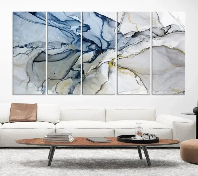 The "Blue and Gray Marble Fluid Effect Wall Art Abstract Canvas Wall Art Print" graces the dark wall, ready to hang. This triptych abstract art boasts a UV-protective coating for vibrant longevity in your space.