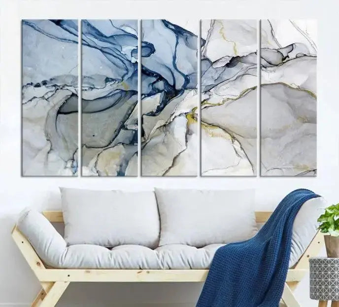 The "Blue and Gray Marble Fluid Effect Wall Art Abstract Canvas Wall Art Print" graces the dark wall, ready to hang. This triptych abstract art boasts a UV-protective coating for vibrant longevity in your space.