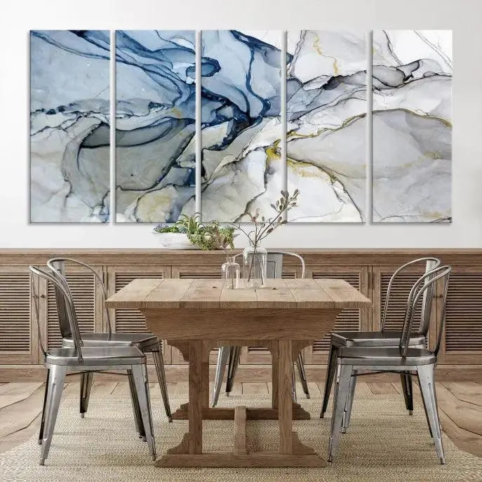 The "Blue and Gray Marble Fluid Effect Wall Art Abstract Canvas Wall Art Print" graces the dark wall, ready to hang. This triptych abstract art boasts a UV-protective coating for vibrant longevity in your space.