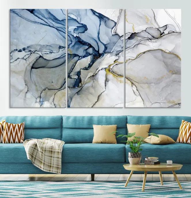 The "Blue and Gray Marble Fluid Effect Wall Art Abstract Canvas Wall Art Print" graces the dark wall, ready to hang. This triptych abstract art boasts a UV-protective coating for vibrant longevity in your space.