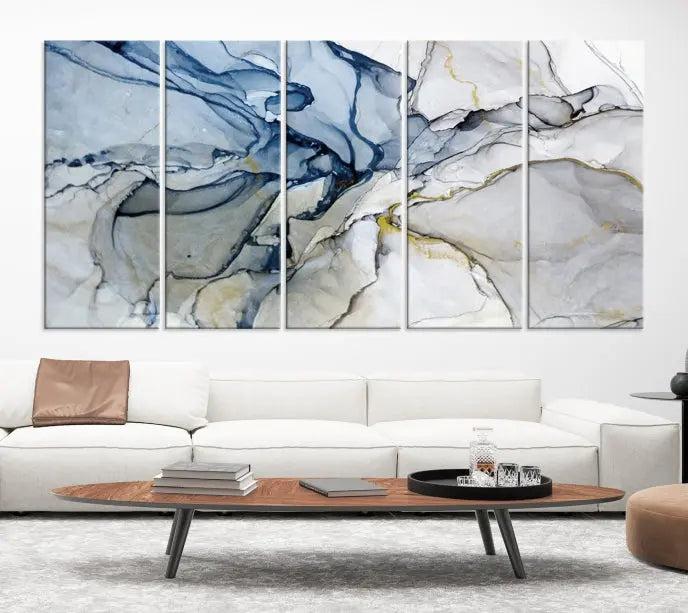 The "Blue and Gray Marble Fluid Effect Wall Art Abstract Canvas Wall Art Print" graces the dark wall, ready to hang. This triptych abstract art boasts a UV-protective coating for vibrant longevity in your space.