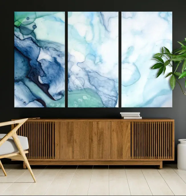 The Blue and Green Marble Fluid Effect Wall Art Abstract Canvas Wall Art Print, gallery wrapped on museum-quality canvas, adorns the black wall.