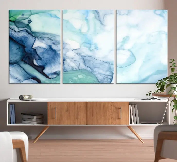 The Blue and Green Marble Fluid Effect Wall Art Abstract Canvas Wall Art Print, gallery wrapped on museum-quality canvas, adorns the black wall.