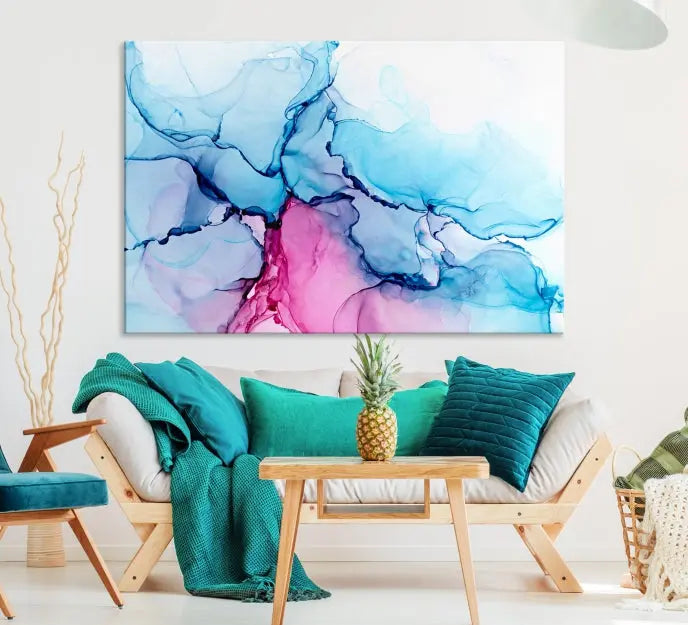 The "Blue and Pink Marble Fluid Effect Wall Art Abstract Canvas Wall Art Print" graces a dark wall. This exquisite piece is created on museum-quality polycotton canvas with a UV-protective coating.