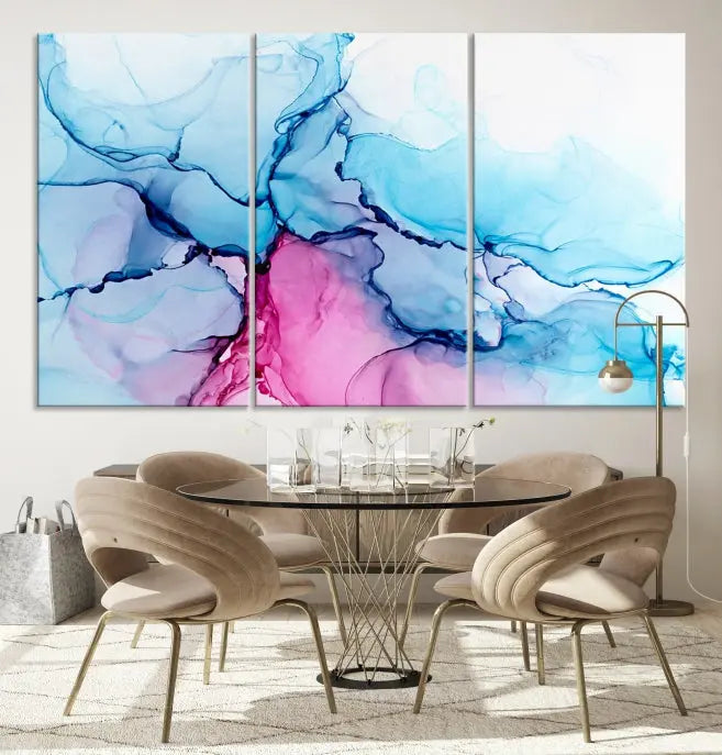 The "Blue and Pink Marble Fluid Effect Wall Art Abstract Canvas Wall Art Print" graces a dark wall. This exquisite piece is created on museum-quality polycotton canvas with a UV-protective coating.