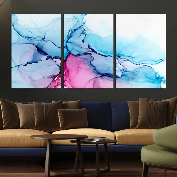 The "Blue and Pink Marble Fluid Effect Wall Art Abstract Canvas Wall Art Print" graces a dark wall. This exquisite piece is created on museum-quality polycotton canvas with a UV-protective coating.