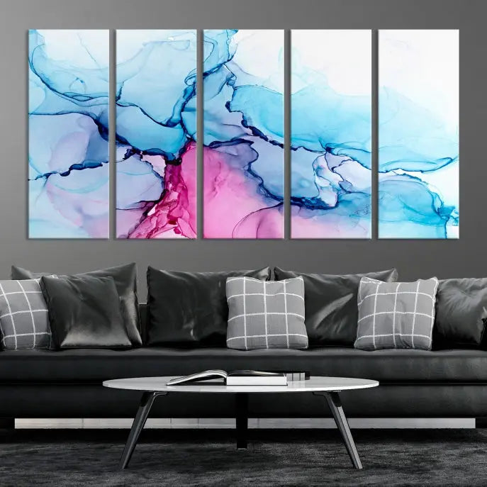 The "Blue and Pink Marble Fluid Effect Wall Art Abstract Canvas Wall Art Print" graces a dark wall. This exquisite piece is created on museum-quality polycotton canvas with a UV-protective coating.