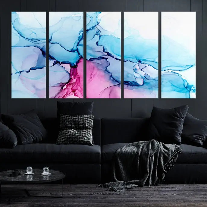 The "Blue and Pink Marble Fluid Effect Wall Art Abstract Canvas Wall Art Print" graces a dark wall. This exquisite piece is created on museum-quality polycotton canvas with a UV-protective coating.