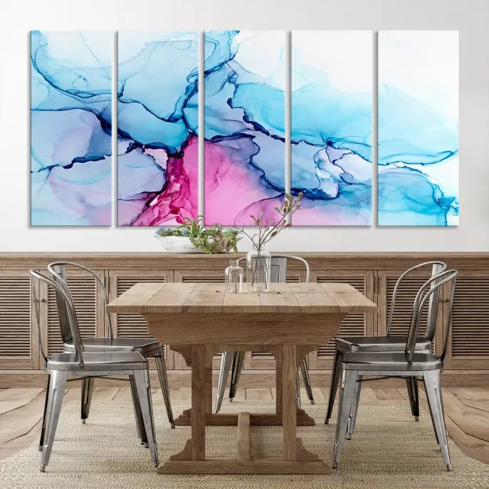 The "Blue and Pink Marble Fluid Effect Wall Art Abstract Canvas Wall Art Print" graces a dark wall. This exquisite piece is created on museum-quality polycotton canvas with a UV-protective coating.