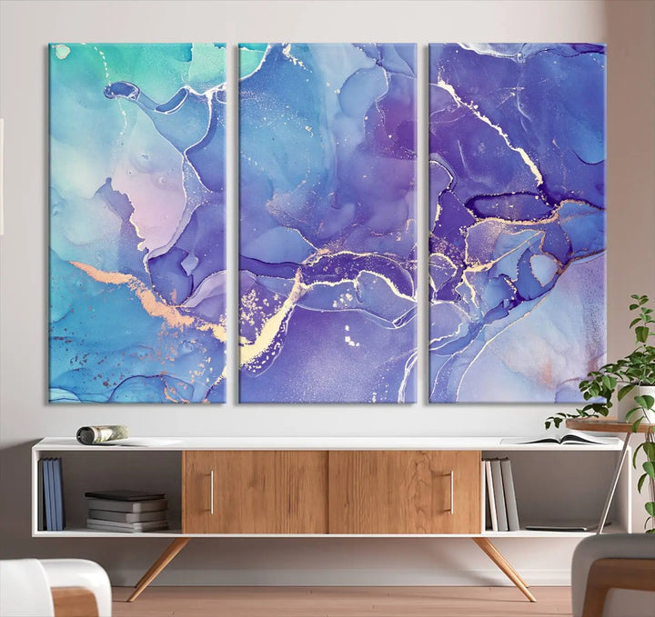 A Blue and Purple Marble Fluid Effect Wall Art Abstract Canvas Print graces the wall. This gallery-wrapped masterpiece is crafted on museum-quality polycotton and finished with a UV-protective coating for enduring brilliance.