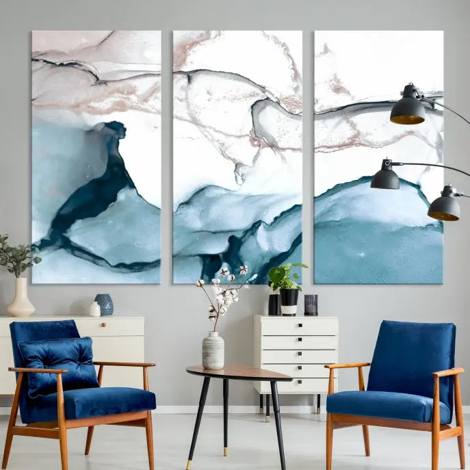 The modern living room features the Blue and Rose Gold Marble Fluid Effect Wall Art Abstract Canvas Art Print displayed on a gray wall.