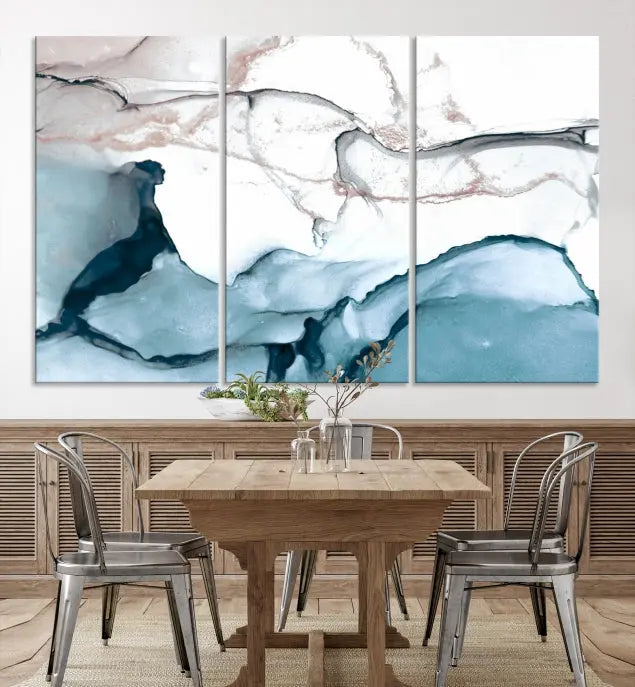 The modern living room features the Blue and Rose Gold Marble Fluid Effect Wall Art Abstract Canvas Art Print displayed on a gray wall.