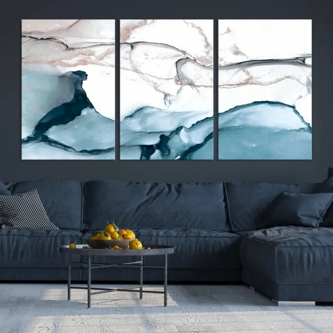 The modern living room features the Blue and Rose Gold Marble Fluid Effect Wall Art Abstract Canvas Art Print displayed on a gray wall.